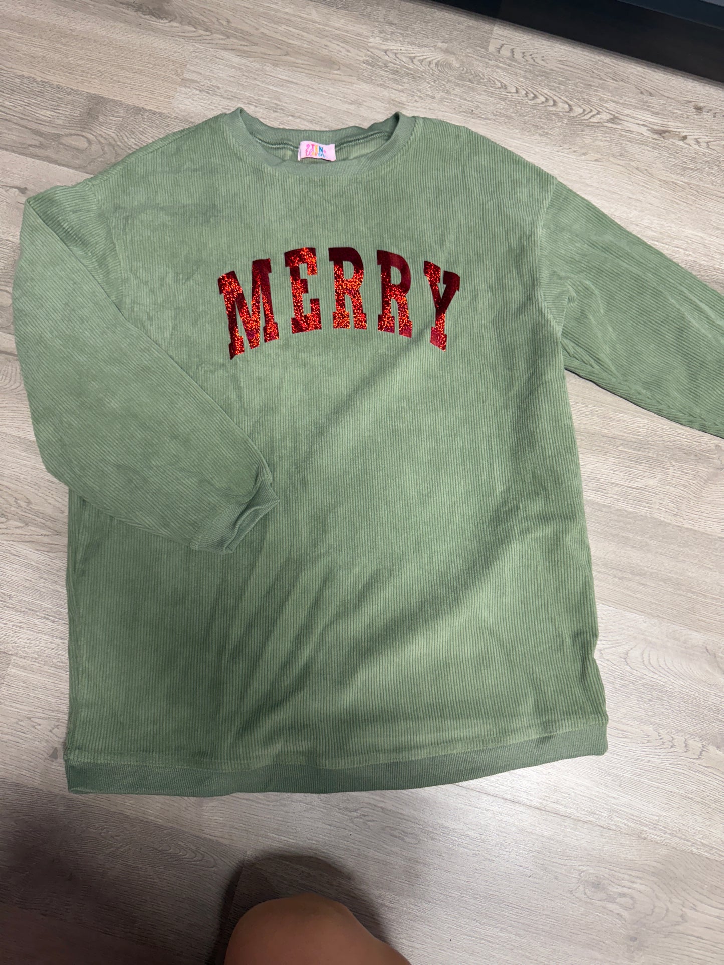 Small merry green sweatshirts with red holographic letters